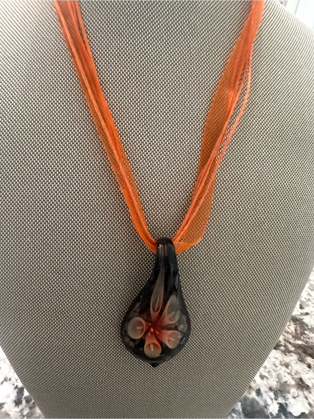 Handcrafted Black Glass Teardrop Necklace with Orange Floral Detail
